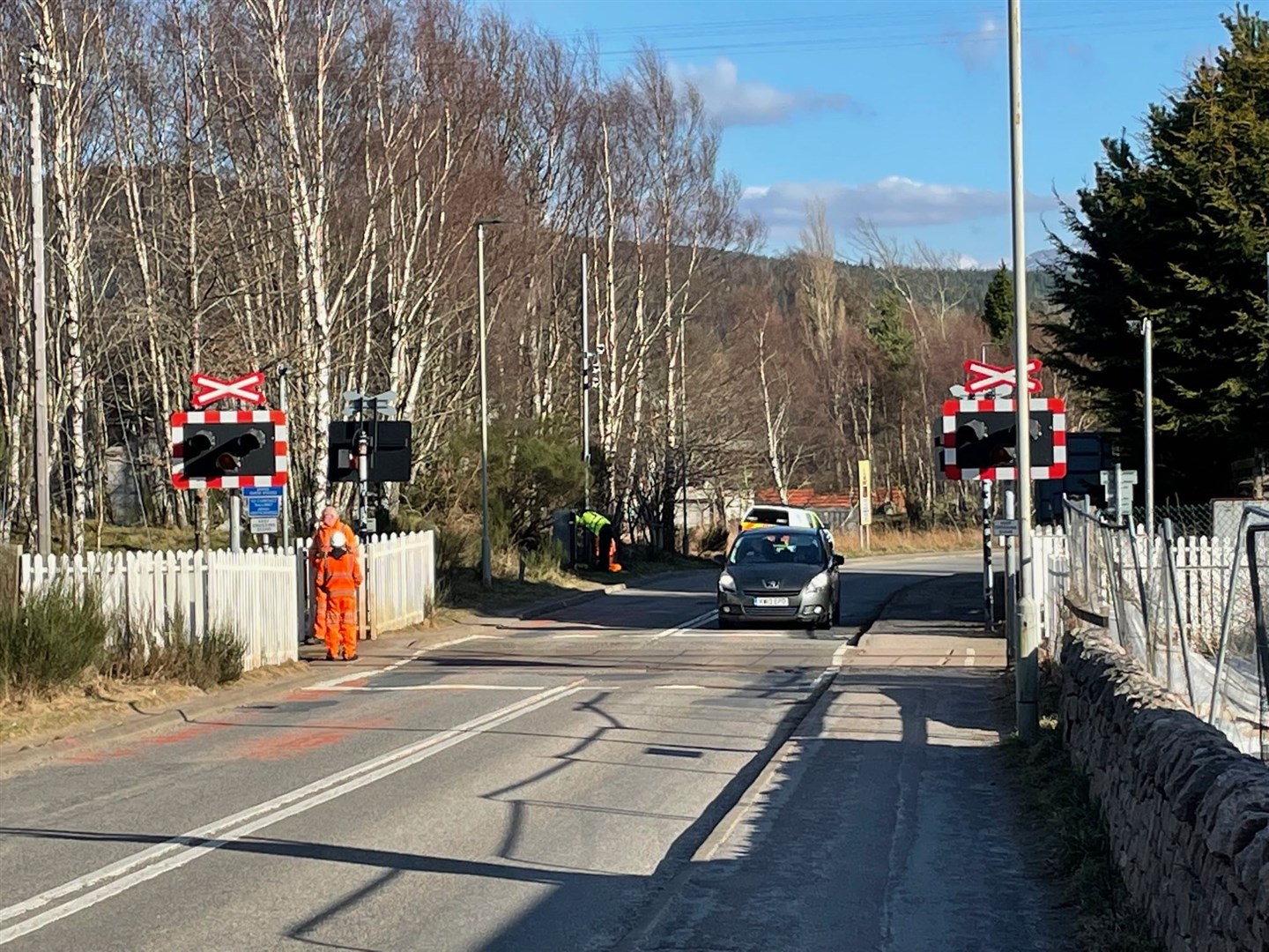 Police at the Dalfaber level crossing a short time after the accident on Sunday.