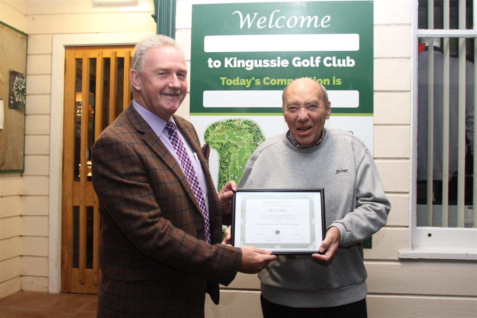 Well done, sir! Keith Hunter, recently retired club vice-president, presents Billy Ogg with his certificate this week for a magnificent club membership of 83 years.
