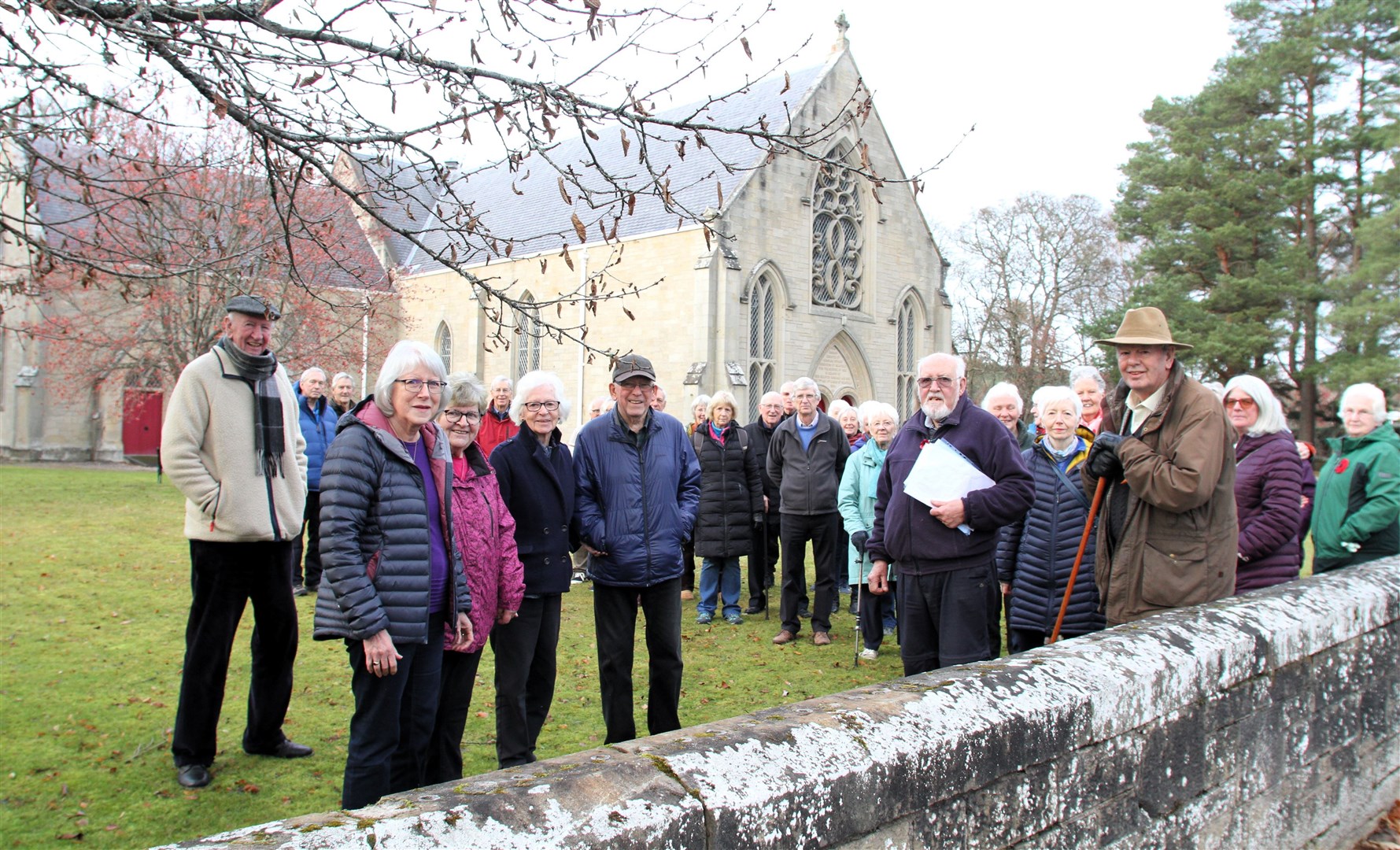 Project supporters including Ann Ralston (front left) in front of Inverallan Church with the south-west roof facing.