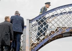 HRH the Duke of Edinburgh and his team cross the footbridge at Kingussie station.