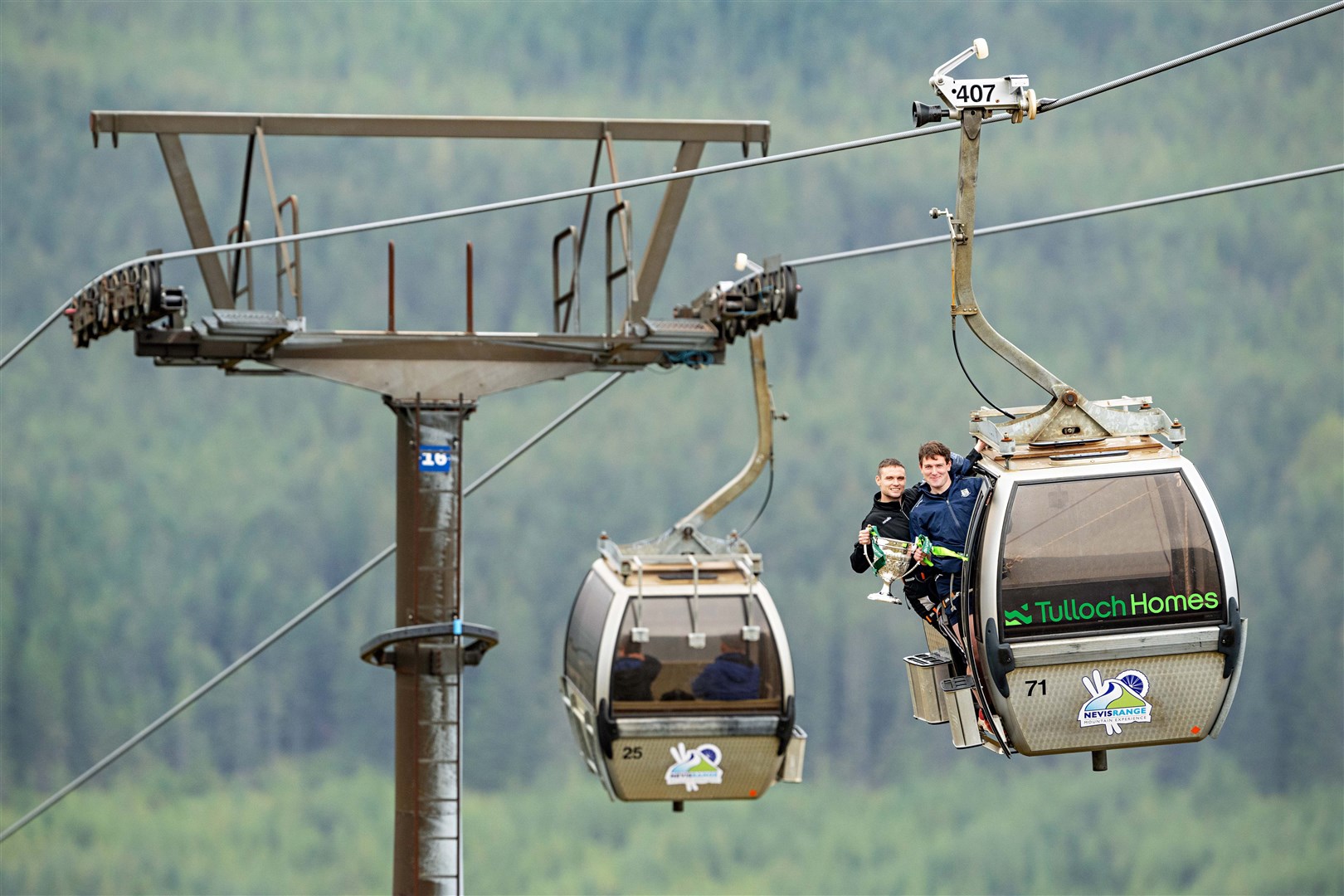 An unusual photo opportunity as Graeme MacMillan and Calum Grant show off the new replica Camanachd Cup Trophy at Nevis Range. Pictures: Neil Paterson.