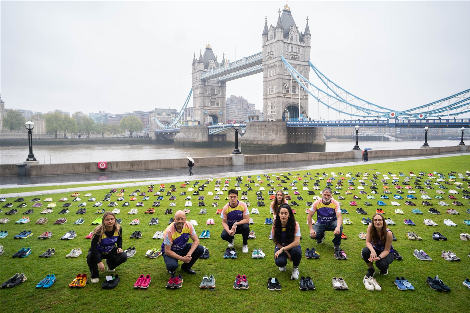 Some 797 trainers representing the number of people who die of the disease each month have been unveiled at Tower Bridge, London (James Manning/PA)
