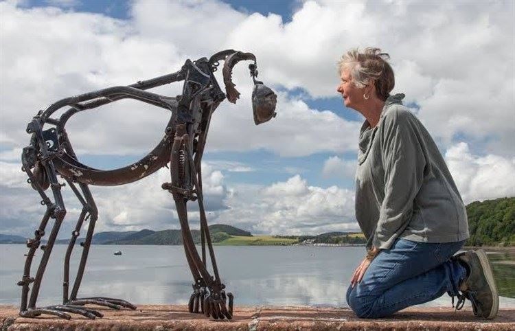 ON THE TRAIL: Helen Denerley has been chosen to fashion a wolf for Kingussie t spark a tourist trail She is pictured with one of her other animals from her hugely popular range.