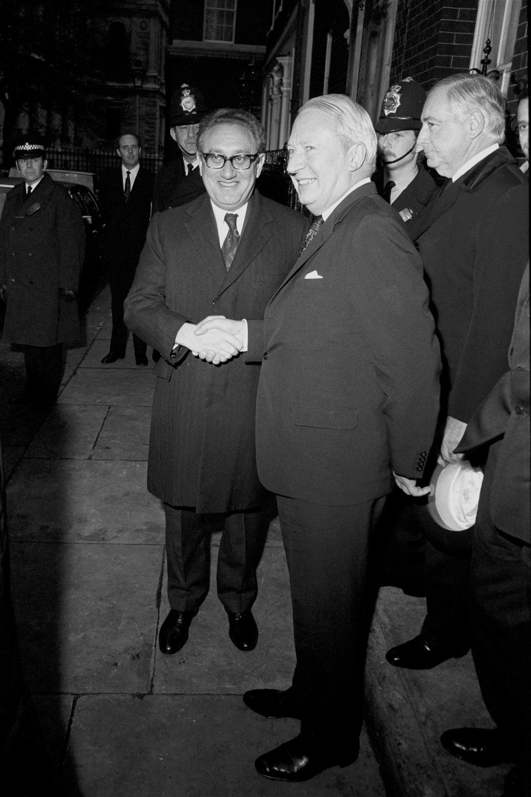 Then-prime minister Ted Heath shakes Mr Kissinger’s hand in 1973 after a working lunch at 10 Downing Street (PA)