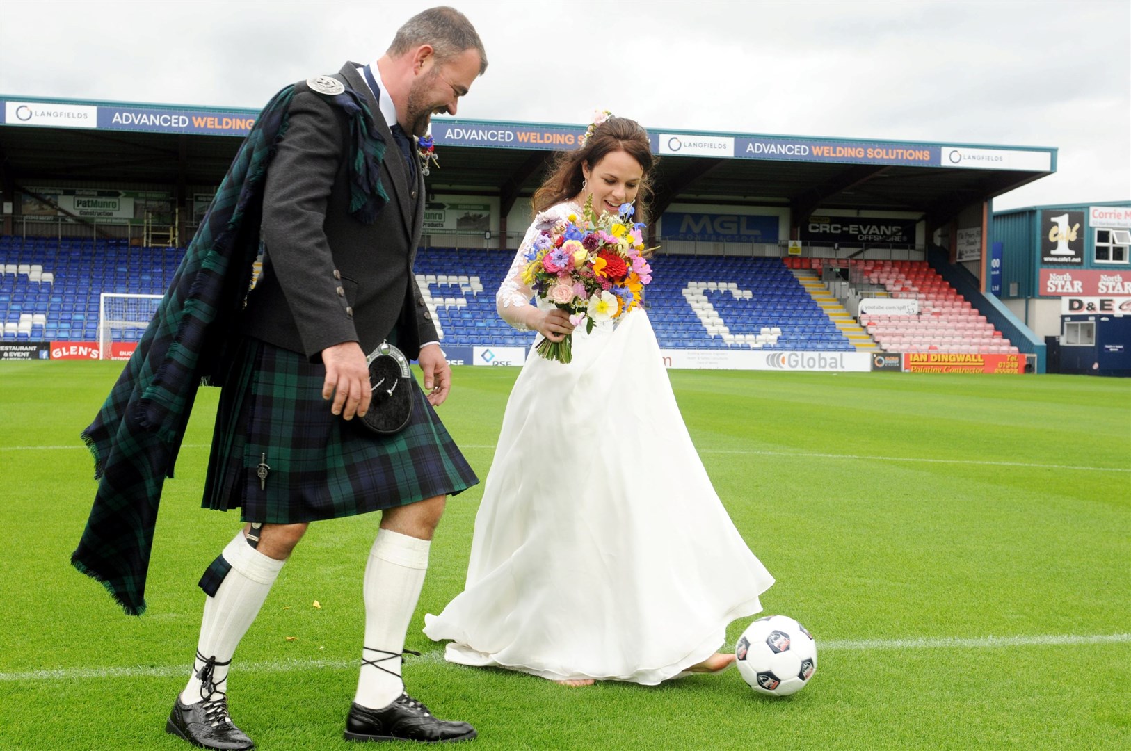 The bridge and groom managed time for a kickabout. Picture: James Mackenzie