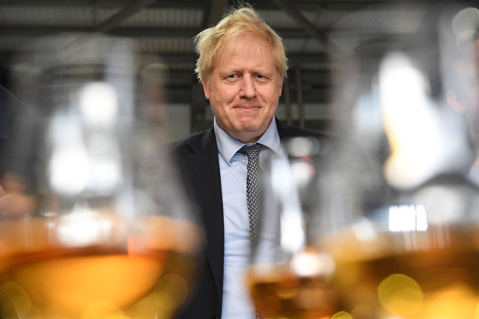 Prime Minister Boris Johnson tastes whisky at the Roseisle Distillery in Scotland near Moray at the start of the General Election campaign. Picture: (Stefan Rousseau/PA).