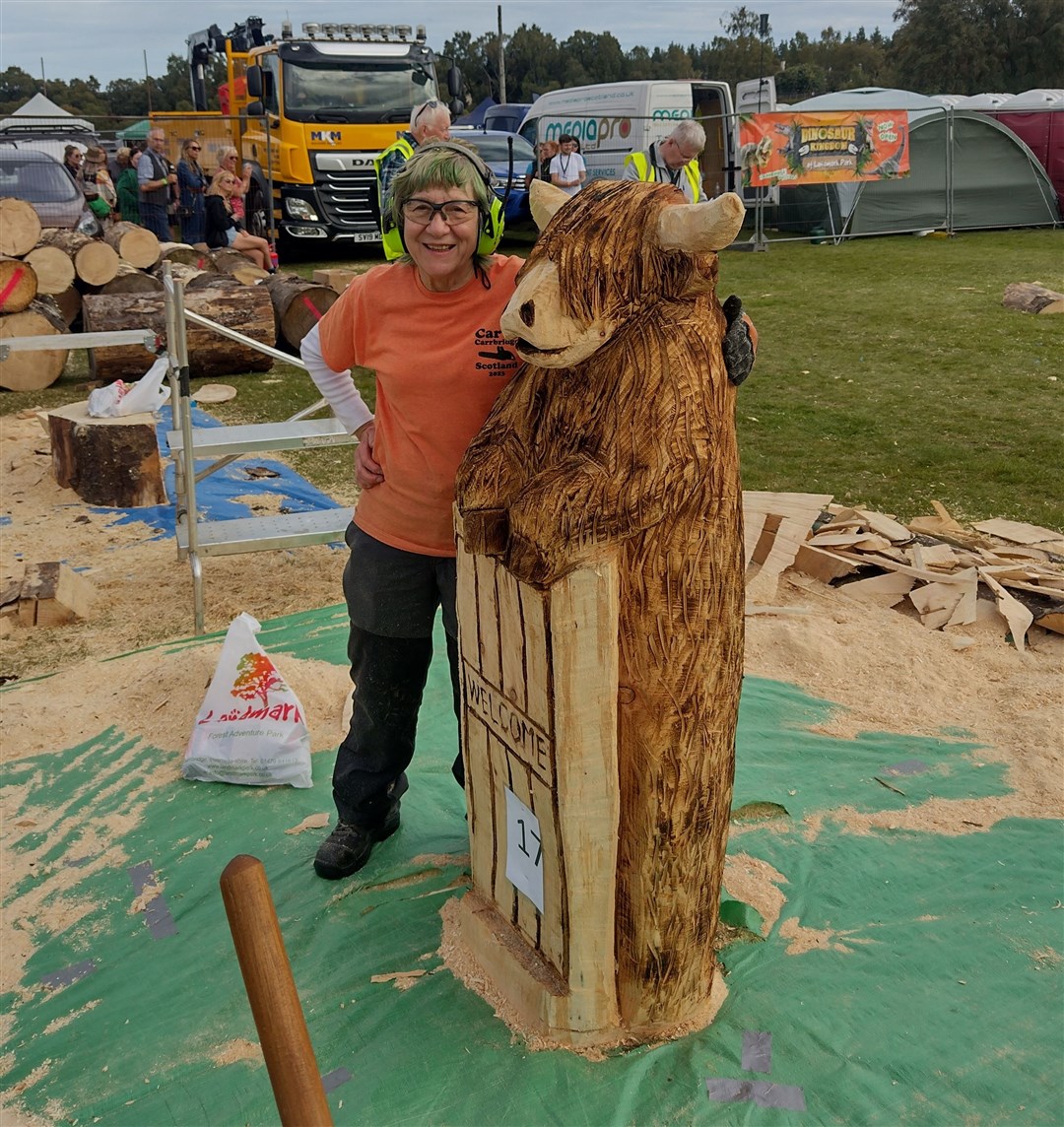 Local sculpture: Alice Buttress gives her creation a big hug.