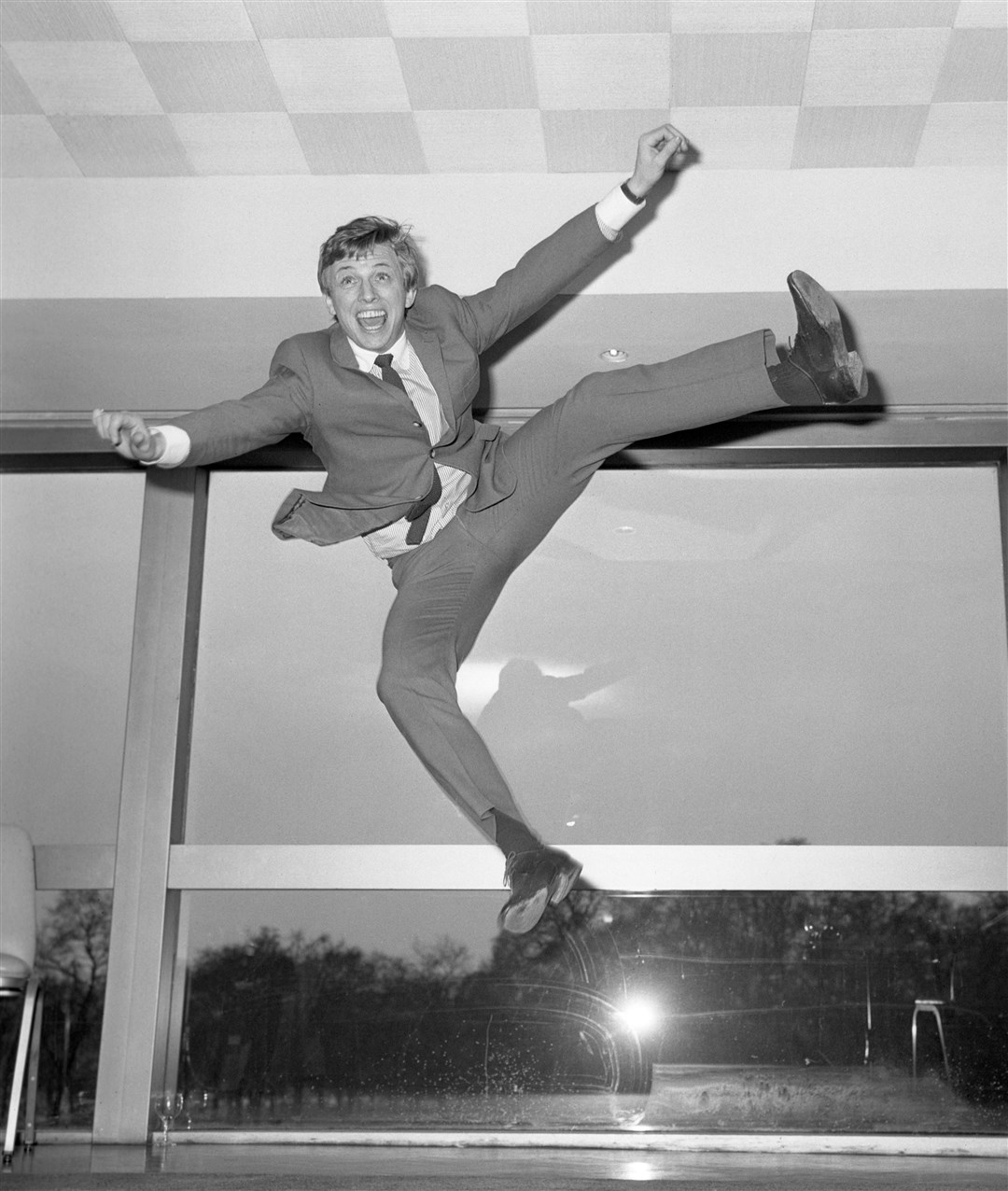 Tommy Steele jumping for joy at a press conference in 1966 (PA)