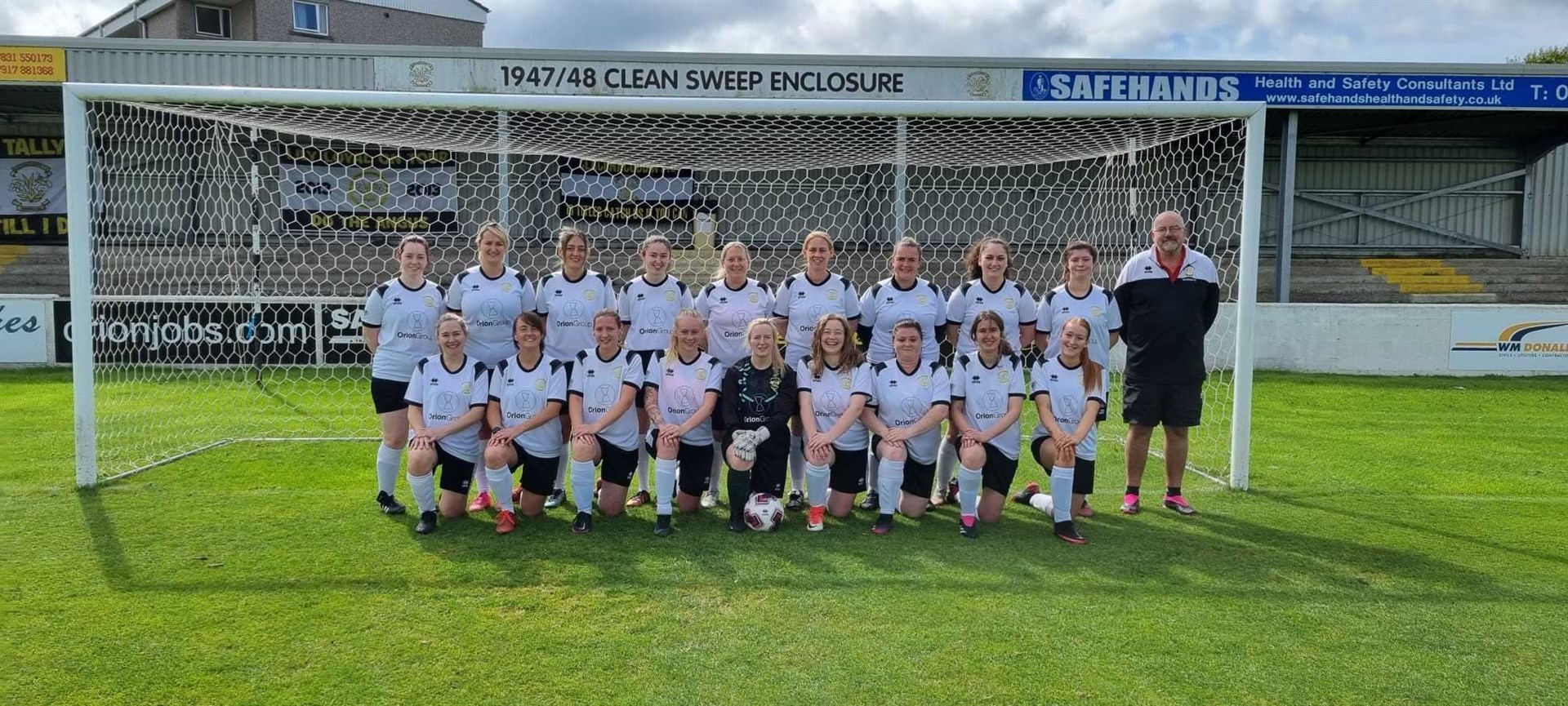 Craig Dishington with Clachnacuddin Women FC players.