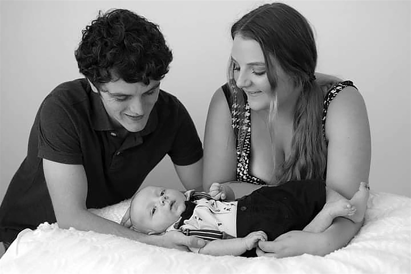 Rosie-Mae Walton, 19, and Wes Powell, 22, with their son Marley (Family/PA)