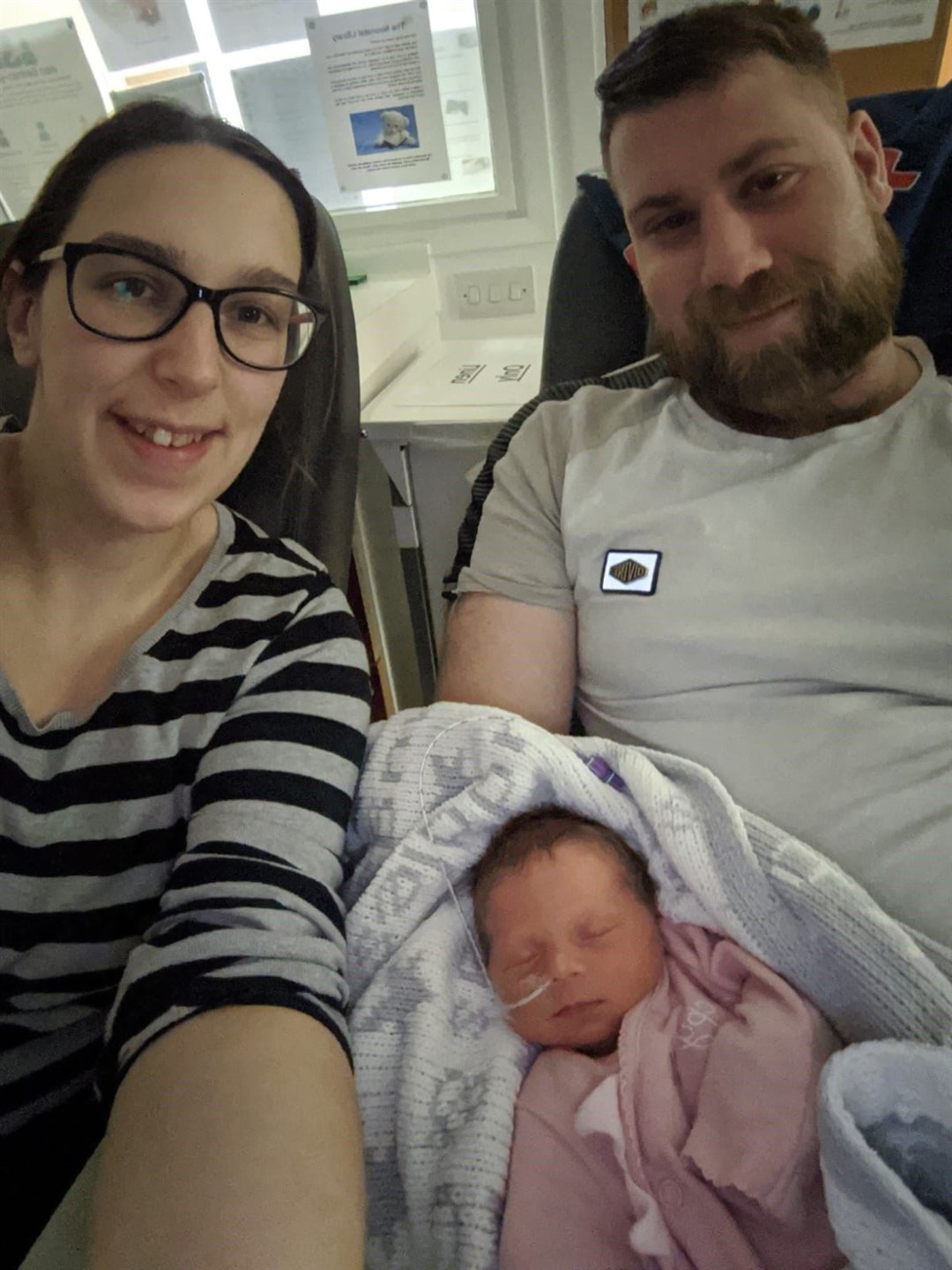 Caroline Rose and Neil Tugby with daughter Heidi from Sandwell near Birmingham (Action for Children/PA)