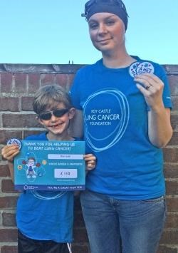 Dominic Leah (8) shows off his Swim a Mile in a Month badge with mum Kate Leah.