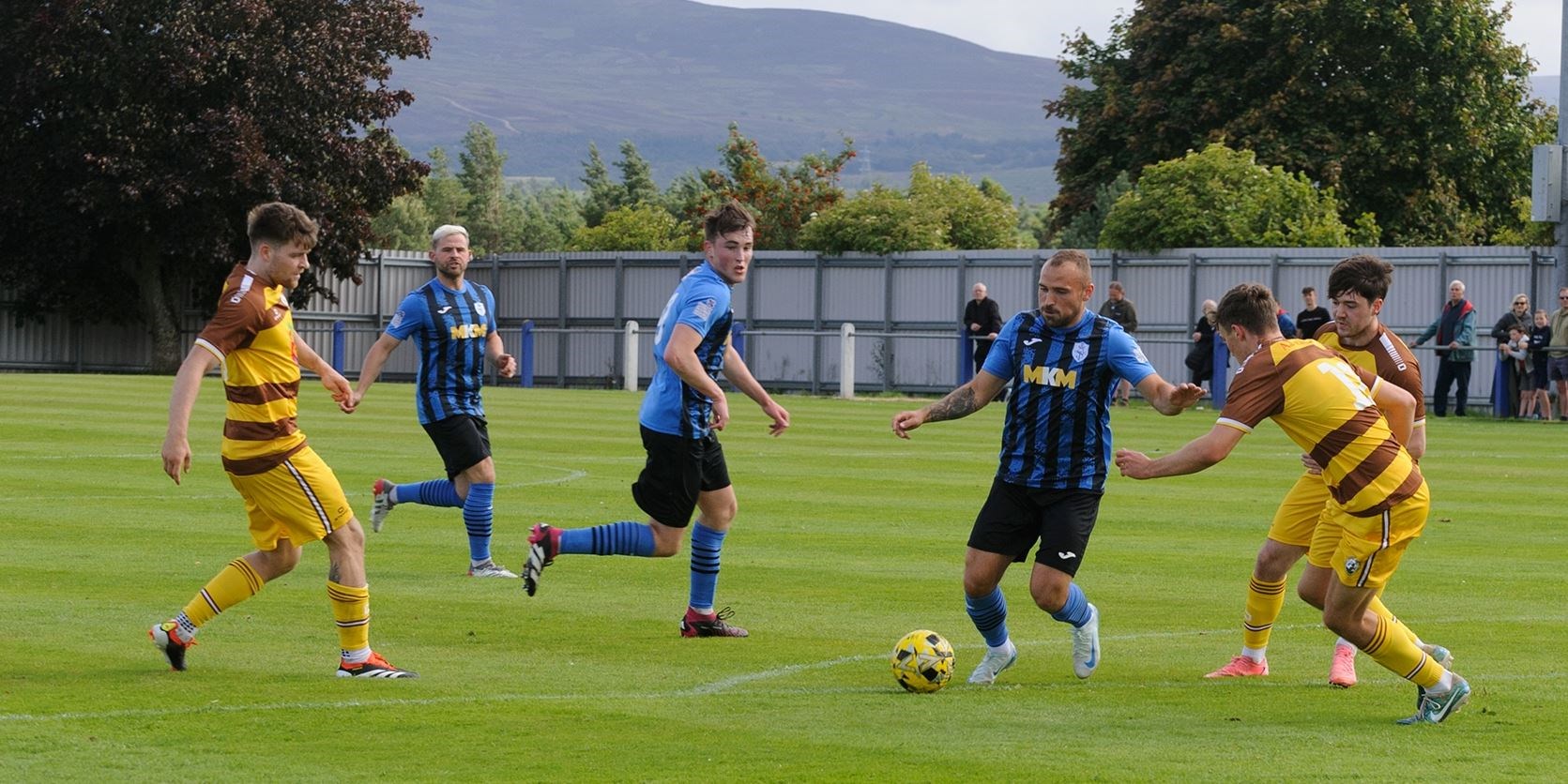 Josh Race tries to find a way thought the Forres defence watched by teammates Gordy McNab and Aaron Nicolson. Picture: Stewart Grant.