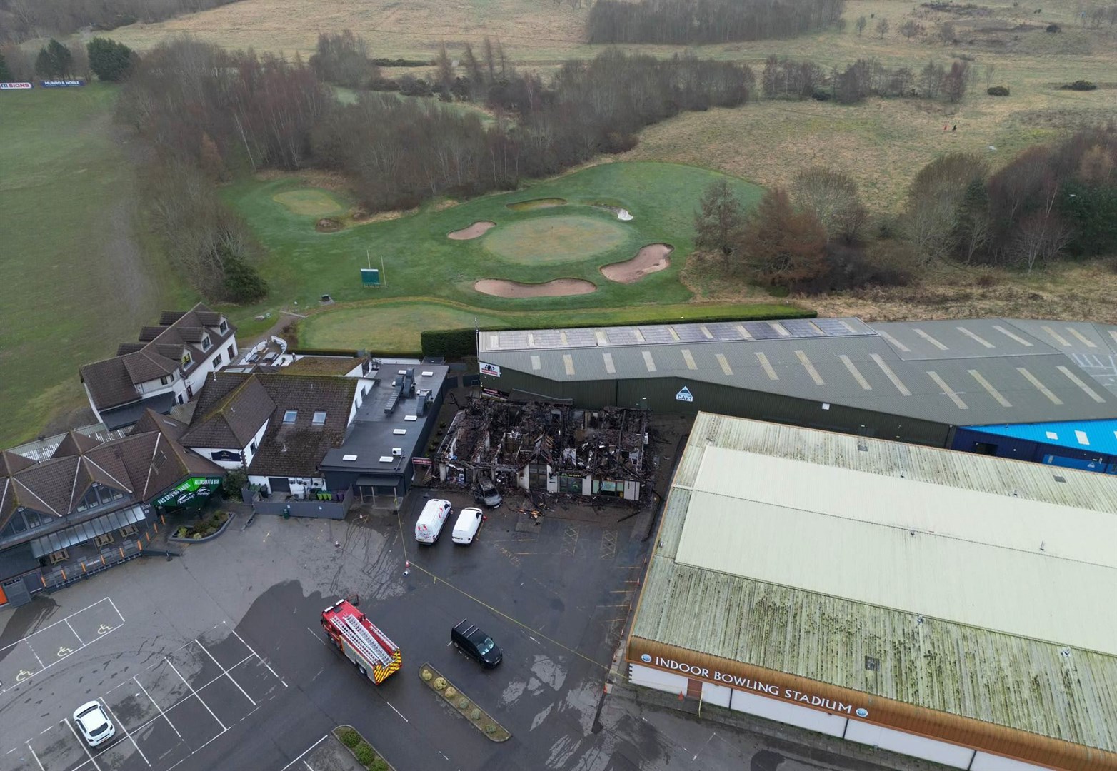 Drone footage reveals the scale of the damage and how close it came to neighbouring buildings. Picture: Walter Geddes.