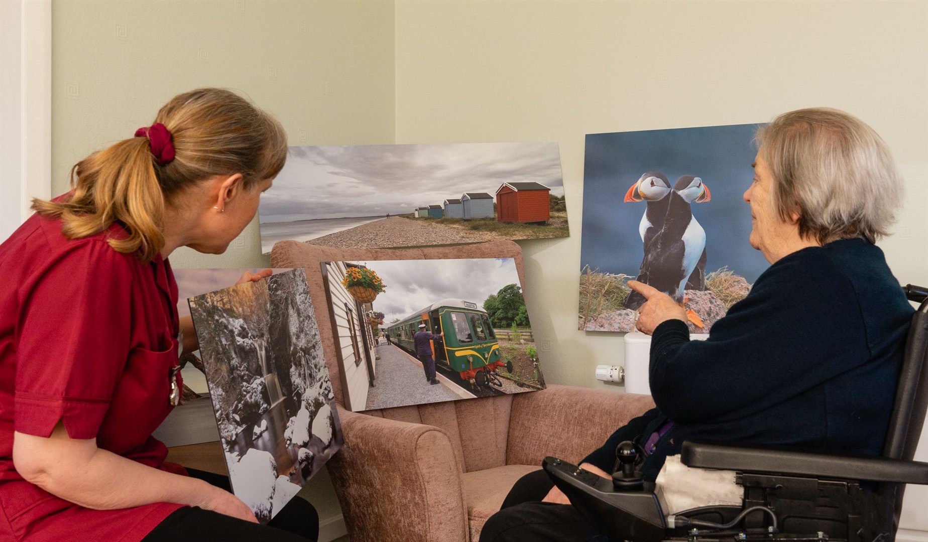 Catherine and Dorothy look at some of the photos.