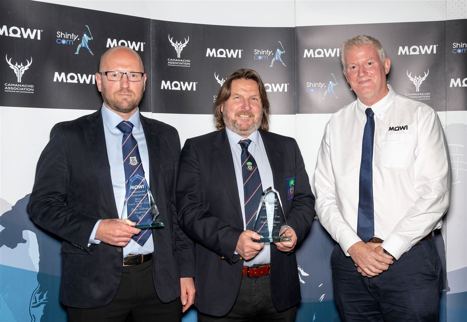 Coach of The Year North Area Leagues, John Gibson (left) and Russell Jones, Kingussie, receive their trophies from Dougie Hunter of sponsors Mowi. Pictures: Neil Paterson.