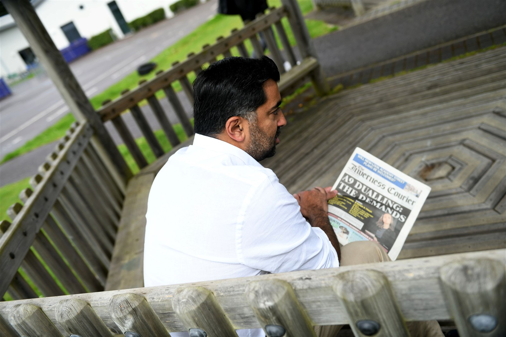 First Minister Humza Yousaf reading the Action Points in Friday's edition of The Inverness Courier. Picture: Callum Mackay.