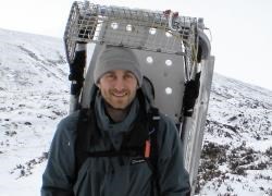 John with half the mountain rescue stretcher attached to his rucksack, ready for the walk back out.