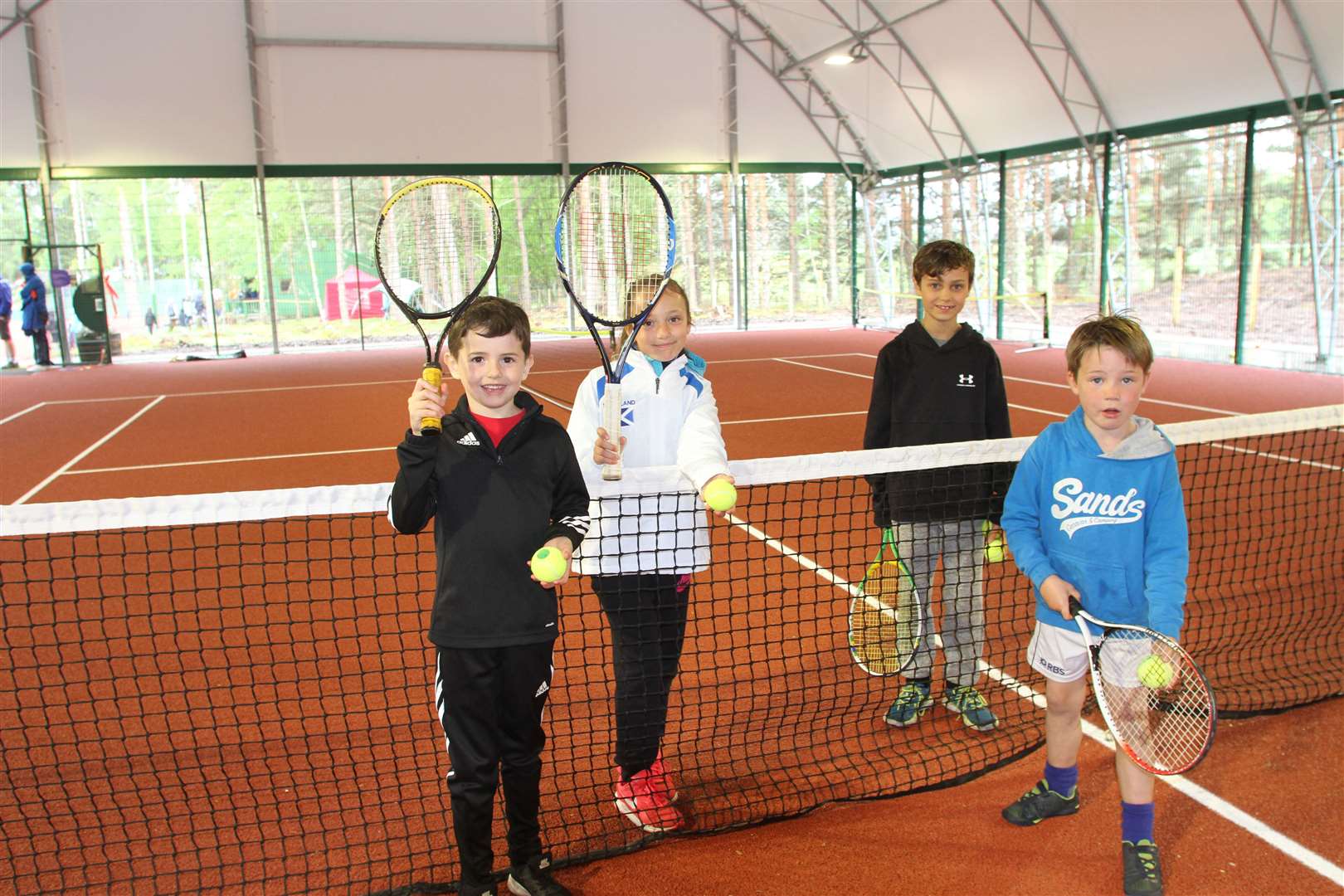 Some budding young tennis players pictured after the opening of the new all-weather court at Rothiemurchus which is the venue for this weekend's contest.