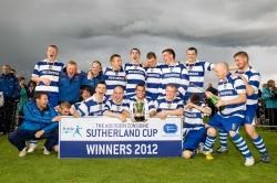Newtonmore players with the cup that has now been taken off them
