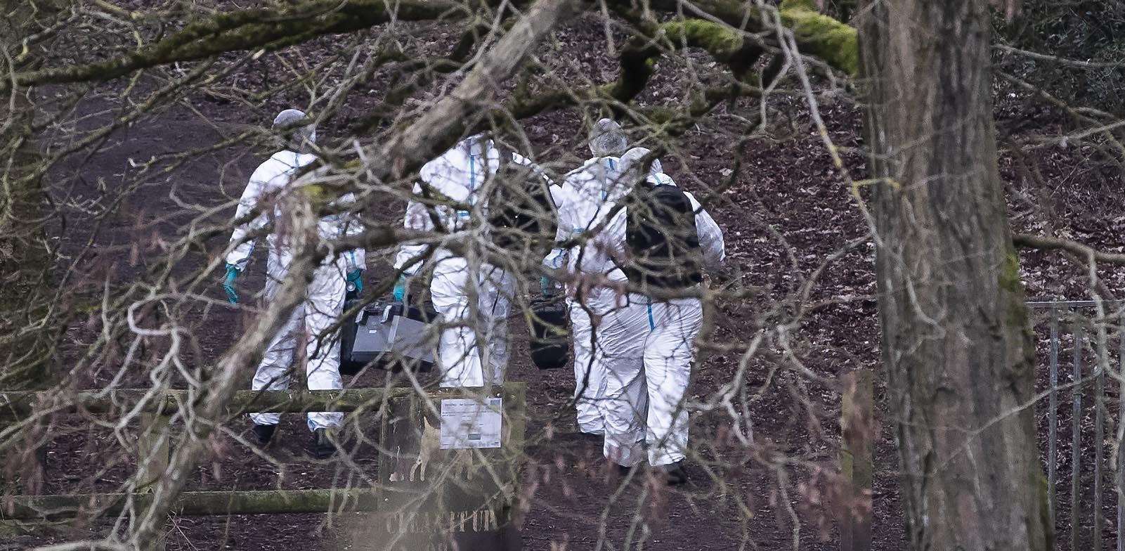 Police forensics officers at the scene in Culcheth Linear Park (Jason Roberts/PA)