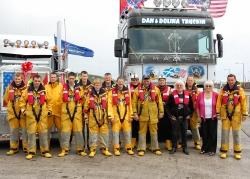 Dan and Dolina Mackenzie with members of the Thurso lifeboat crew and the American Peterbilt truck.