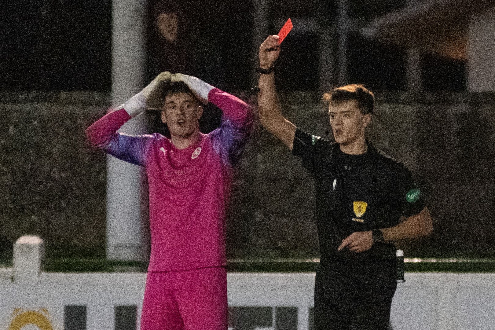 Referee Joel Kennedy sends Brora keeper Lenny Wilson for an early bath. ..Picture: Daniel Forsyth..