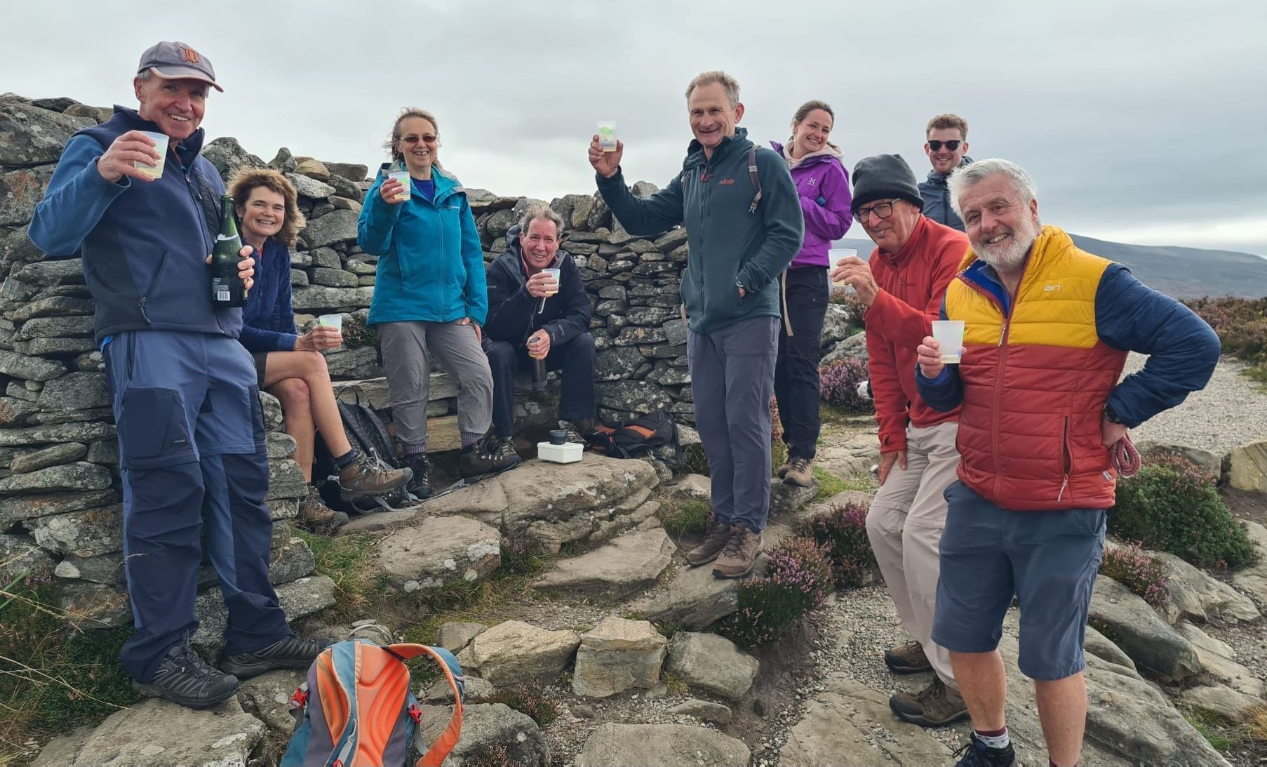 OVER THE HILL? A THOUSAND TIMES YES! Gordon (left) celebrates his 'grand' achievement with friends.