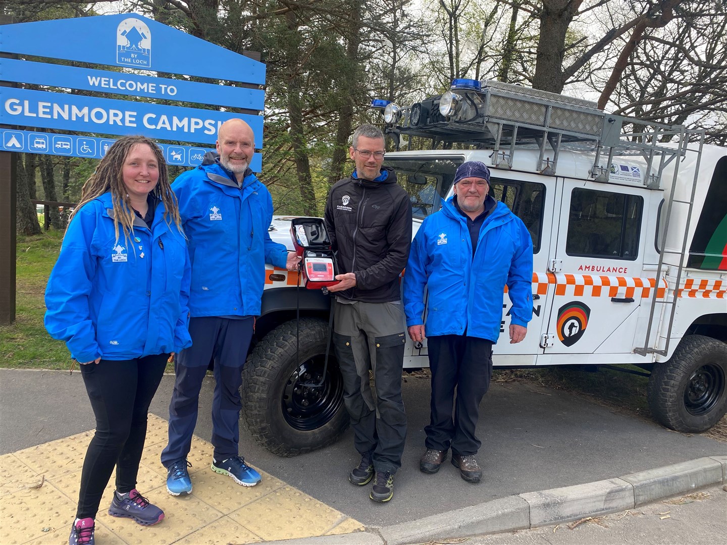 At the handover are Keri Watson, Brian Fulton and Brian Goldie, of Glenmore Campsite, with CMRT leader Iain Cornfoot (second right).