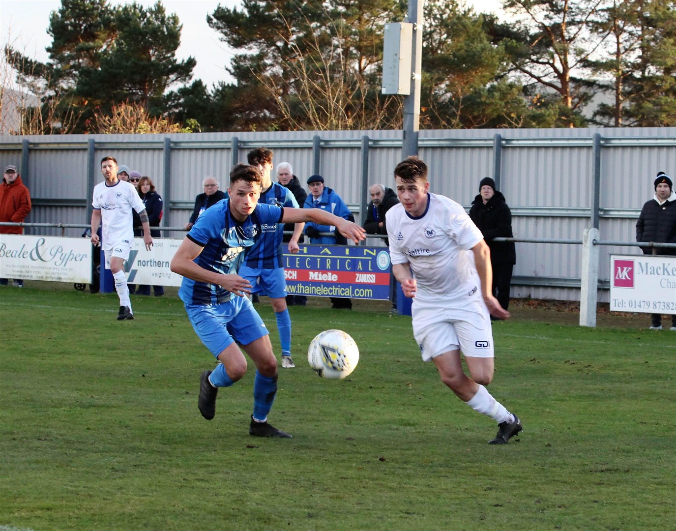 Strathspey Thistle's Jack Gilliland (left) battles for the ball on Saturday against Banks O'Dee. Picture: Frances Porter.