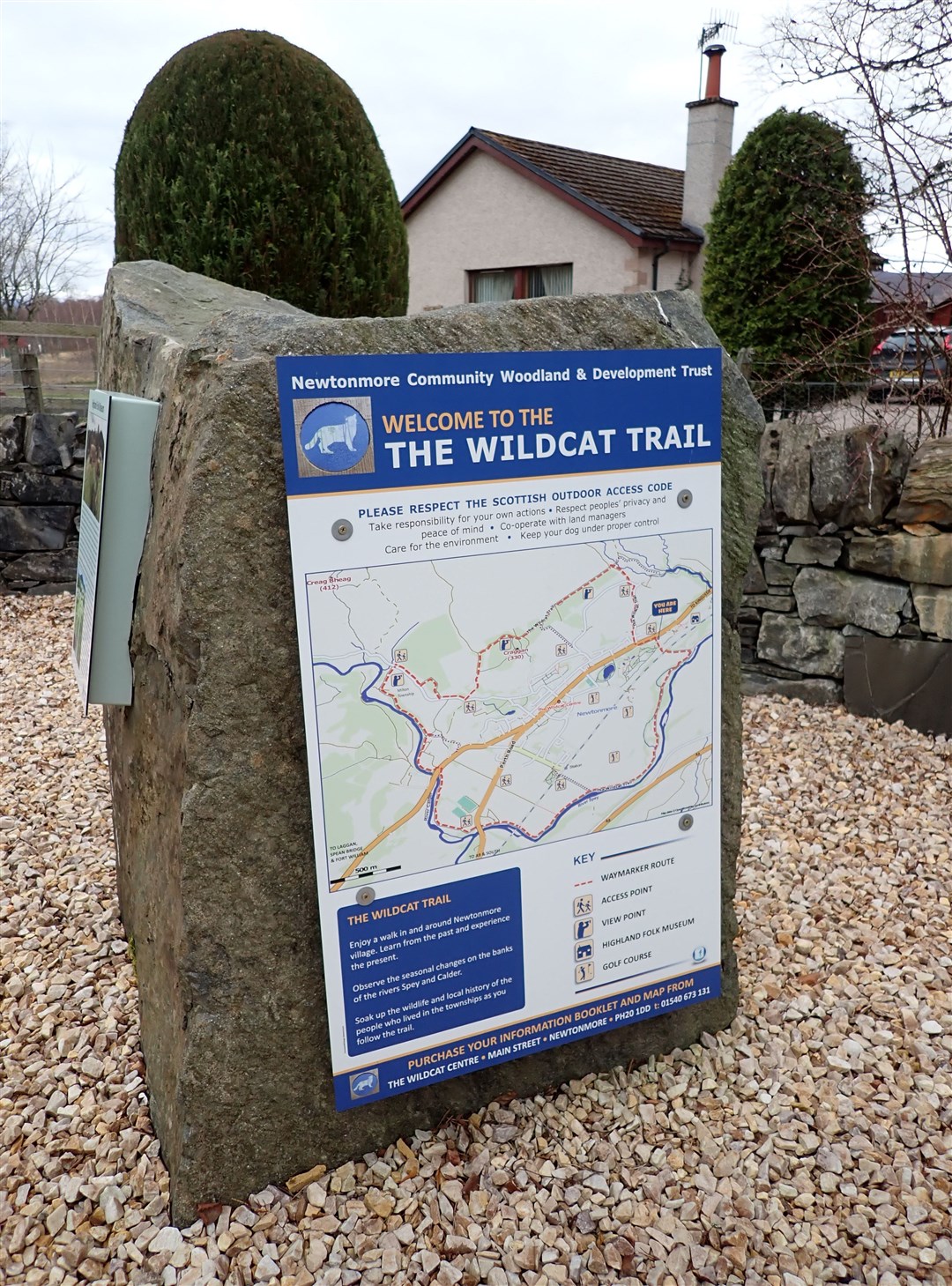 This boulder near the north end of the village has information about the trail.