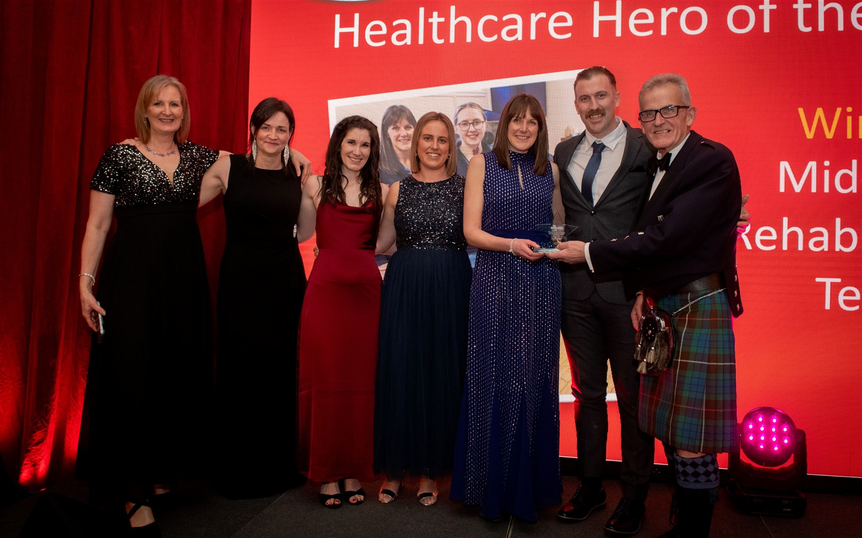 The Mid Ross Rehabilitation Team takes a bow after being named winner in the Healthcare Hero of the Year category. Picture: Callum Mackay.