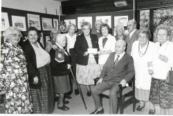 Mrs Celia Thompson (centre left) secretary of the Inverness branch of the Scottish Co-op Trust presents a cheque to Mrs I. McArdle, who along with Ann Lennox, helps users of the Wade Centre in Kingussie to paint pictures. The money handed over in 1998 was