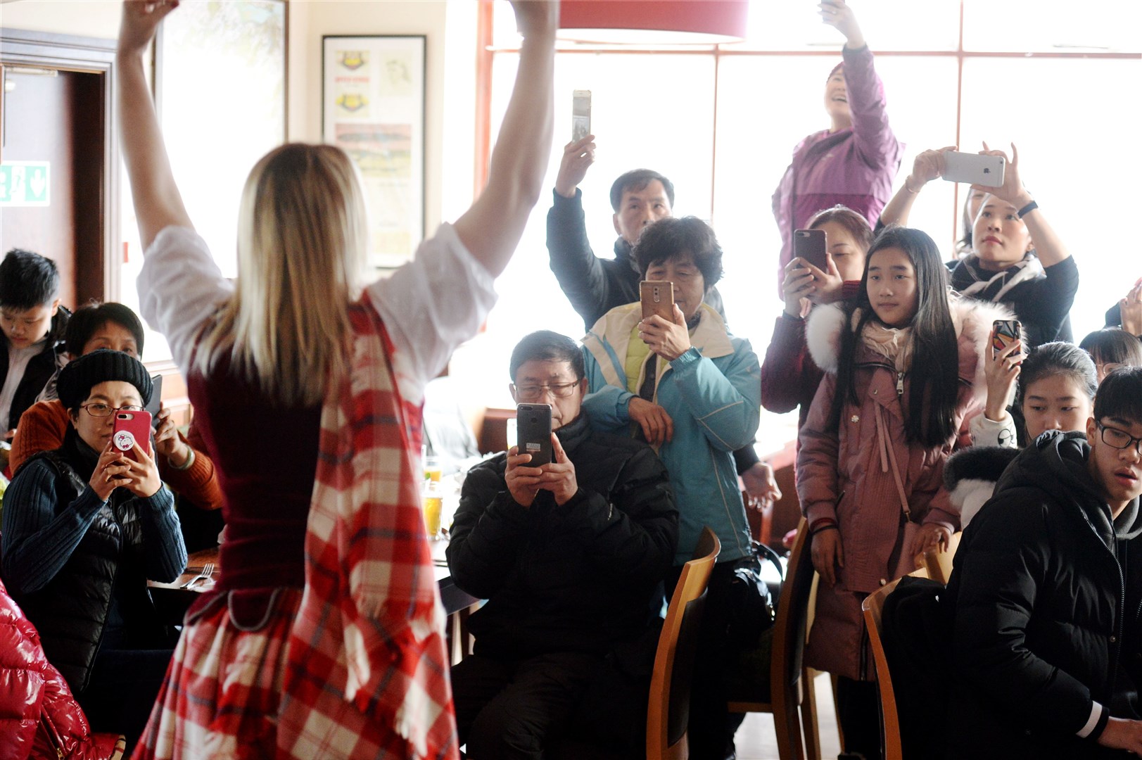 Willie Cameron of the Clansman Hotel welcomes Chinese visitors from Guangdong Province on th eve of Chinese New Year..The visitors get there cameras out during Highland Dance demonstration by Sheryl Heggie..Picture: Gary Anthony. Image No.040326.