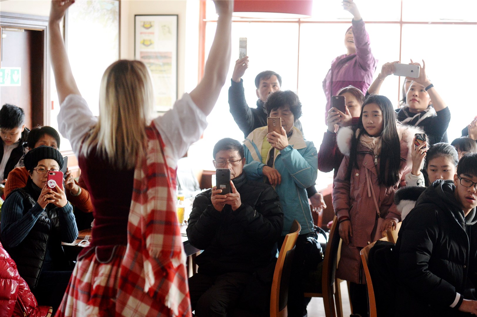 Willie Cameron of the Clansman Hotel welcomes Chinese visitors from Guangdong Province on th eve of Chinese New Year..The visitors get there cameras out during Highland Dance demonstration by Sheryl Heggie..Picture: Gary Anthony. Image No.040326.