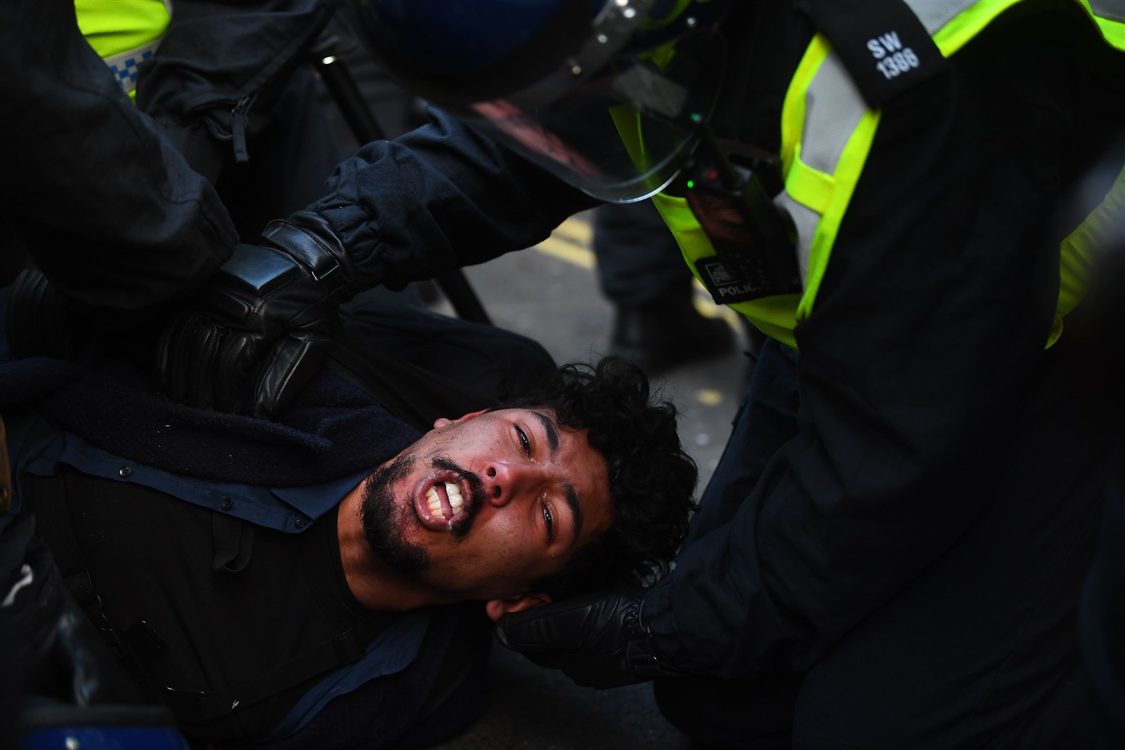 Police detain a man at Oxford Circus (Victoria Jones/PA)