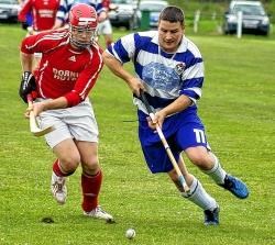 Newtonmore's Glen MacKintosh closes in ahead of Kinlochshiel's Johndon Mackenzie.