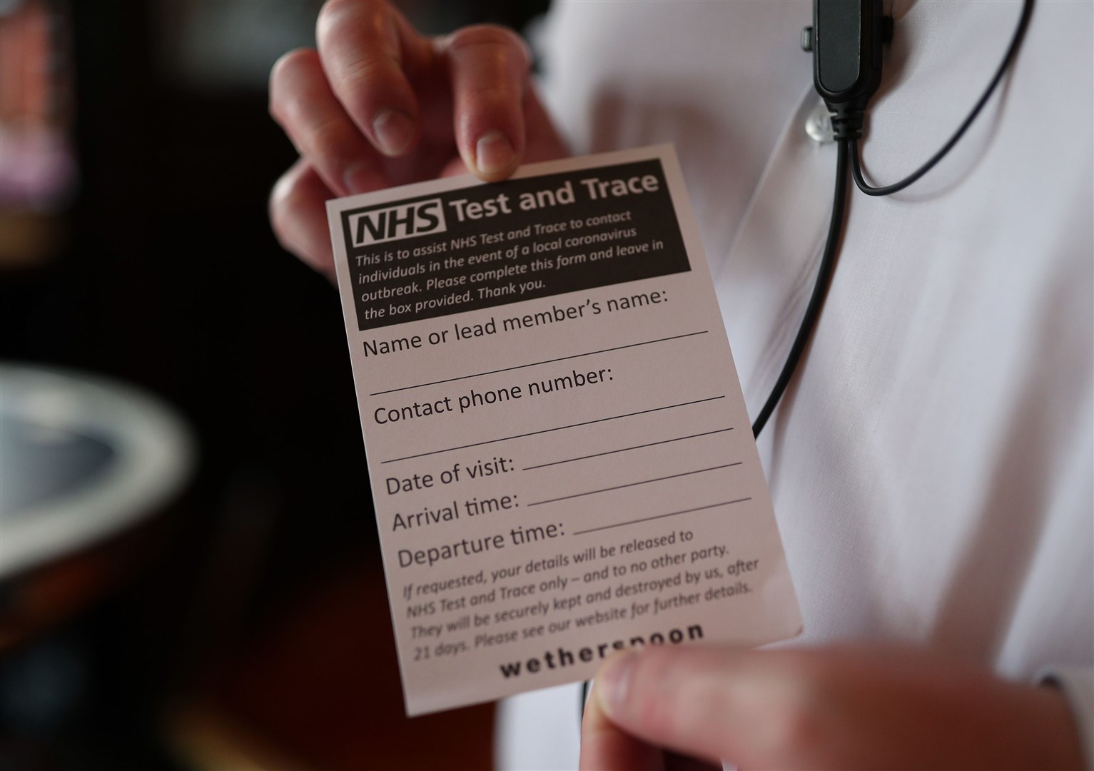 An NHS Test and Trace form offered to customers at the Shakespeare’s Head pub in London (Yui Mok/PA)