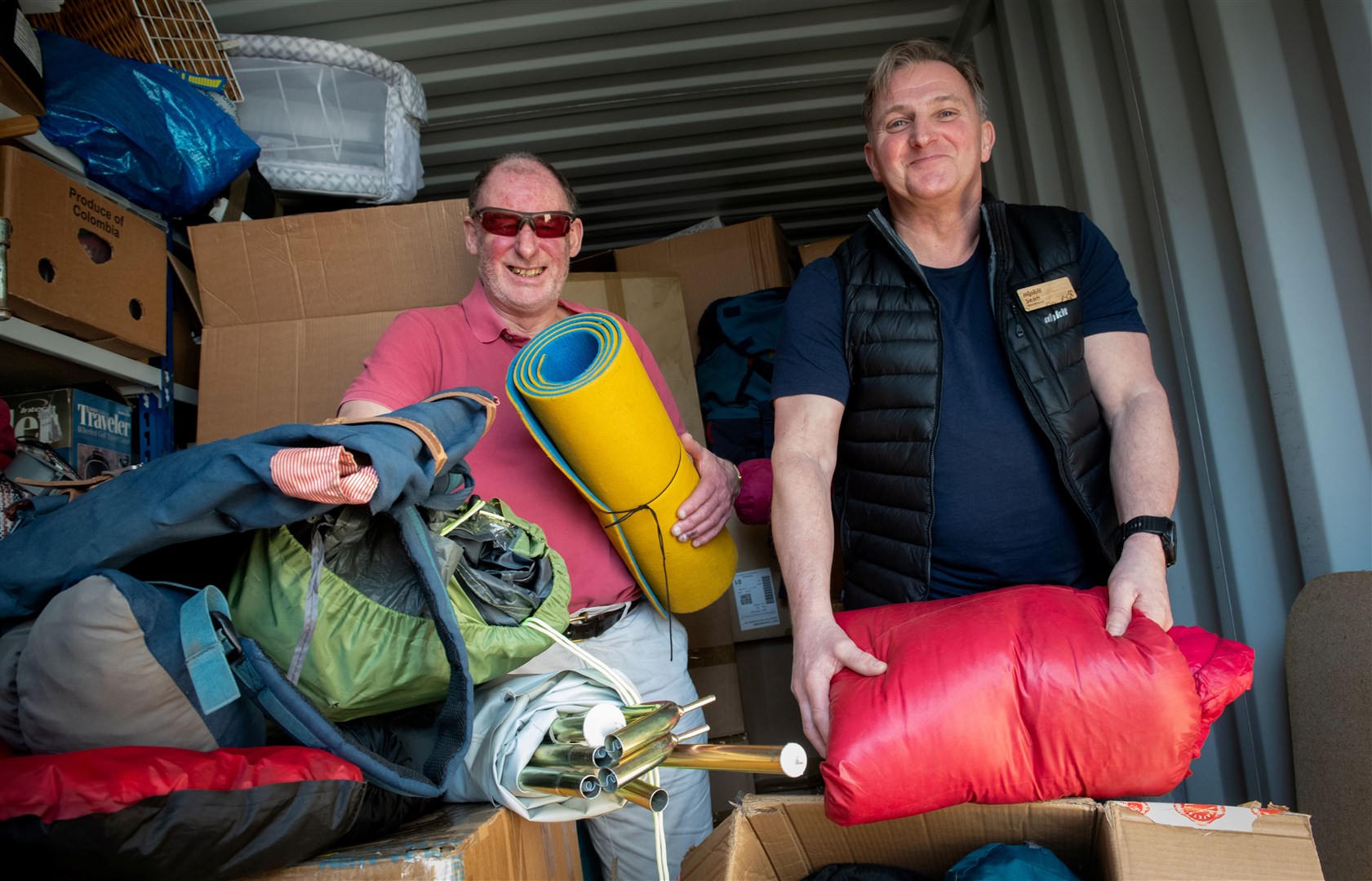 Aid destined for Ukraine is sorted in Inverness by James Hotchkis and Sean Urwin. Picture: Callum Mackay.