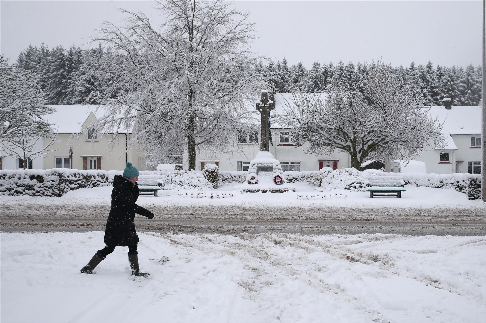 A woman walks through the snow in Braco, near Dunblane (Andrew Milligan/PA)