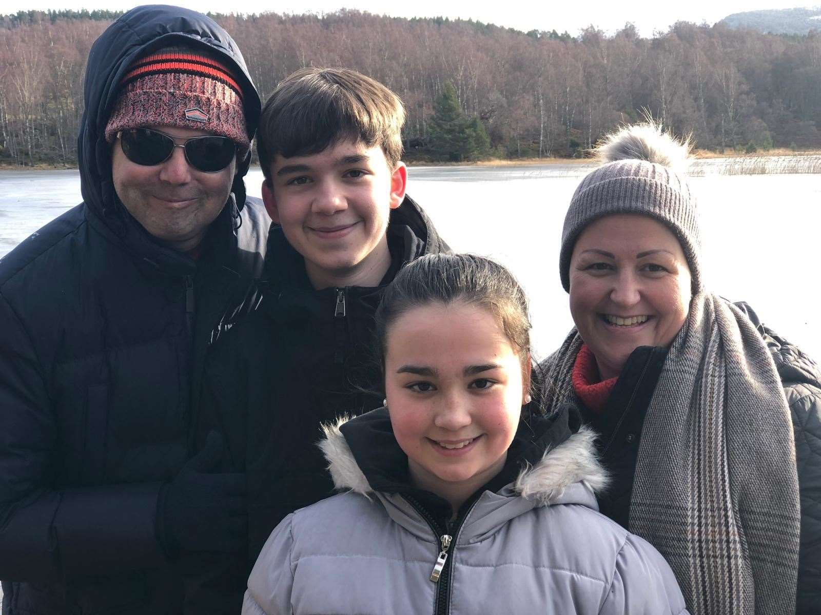 Happy days: Mikey and family at their favourite beauty spot of Loch Morlich