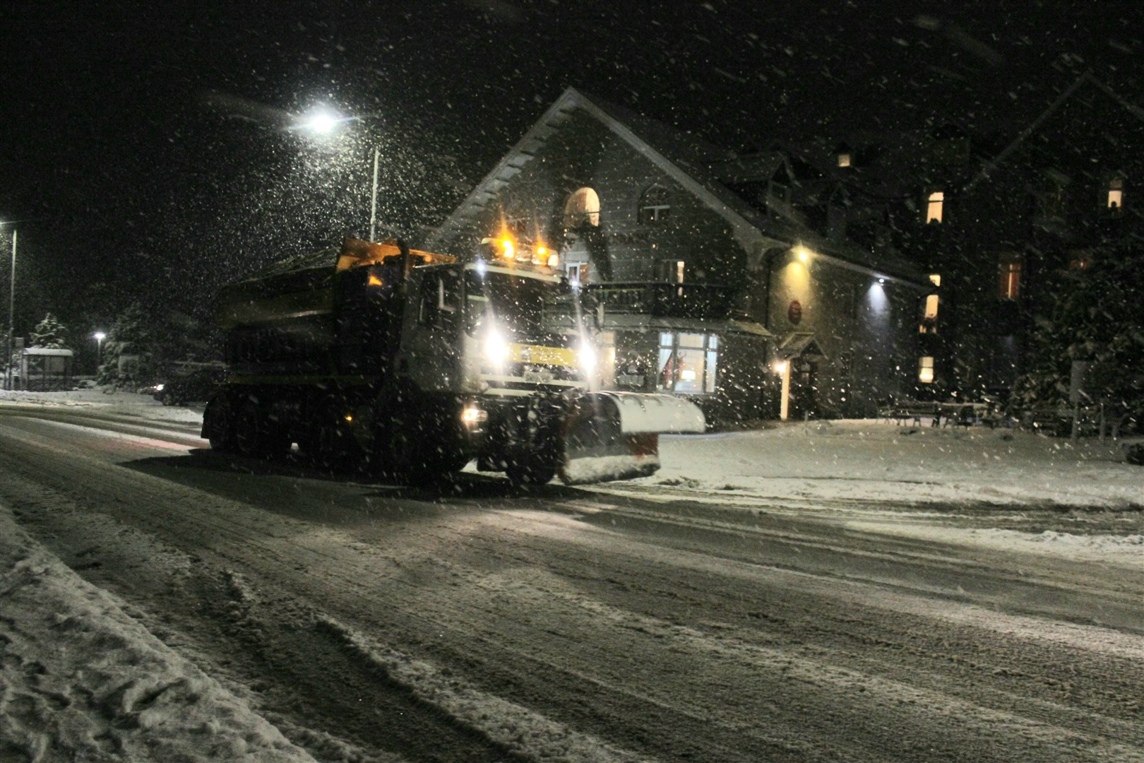 A snow plough at work in Kingussie. BEAR Scotland looks after the trunk roads while the council is responsible for the local roads network.