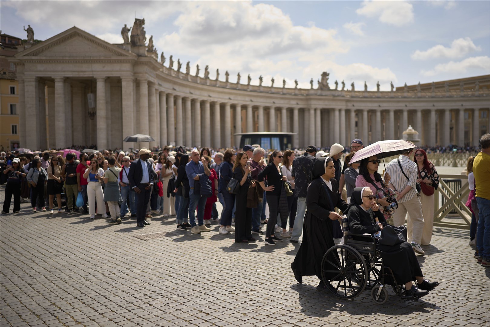 People stood in the sun for hours to pay their respects to the late Pope Francis (Emilio Morenatti/AP)