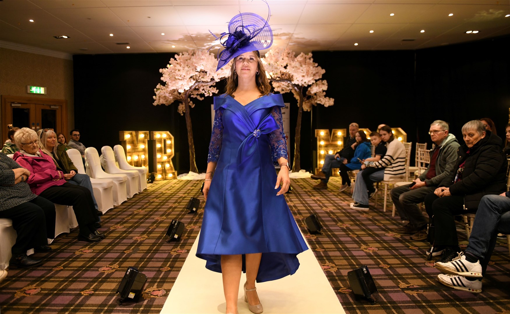 Cal wearing a cobalt dress with cobalt hatinator for La-Di-Da Fashion. Picture: James Mackenzie.