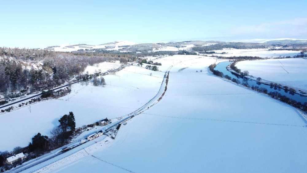 Road, rail and river in the snow. Broomhill Station sits between Strathspey's other transport systems. Sandrone