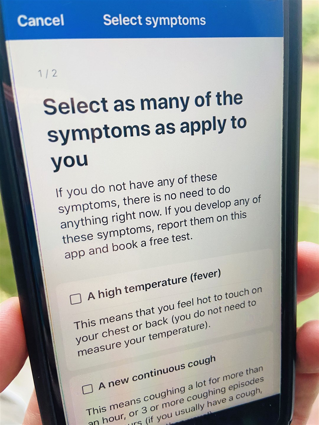 A person using the NHS Covid-19 app (Scott D’Arcy/PA)