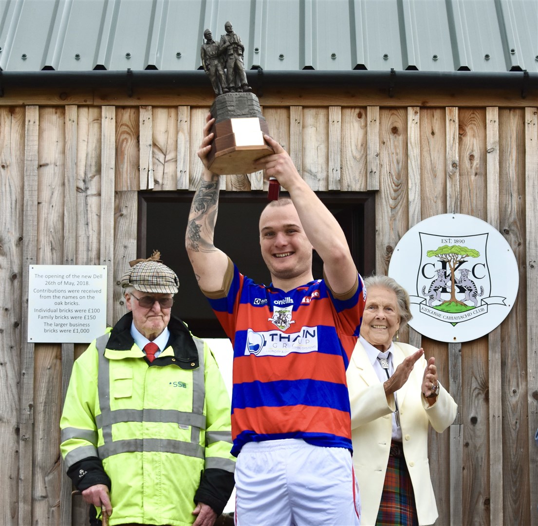 Kings captain Savio Genini lifts the Sir Tommy Macpherson Memorial Trophy after the Red and Blues won the match on a penalty shoot-out after a thrilling 3-3 draw in normal time against Newtonmore. He is hoping to get his hands on the sports most prized trophy of them all –the Tulloch Homes Camanachd Cup – this Saturday. Picture: Fiona Young.