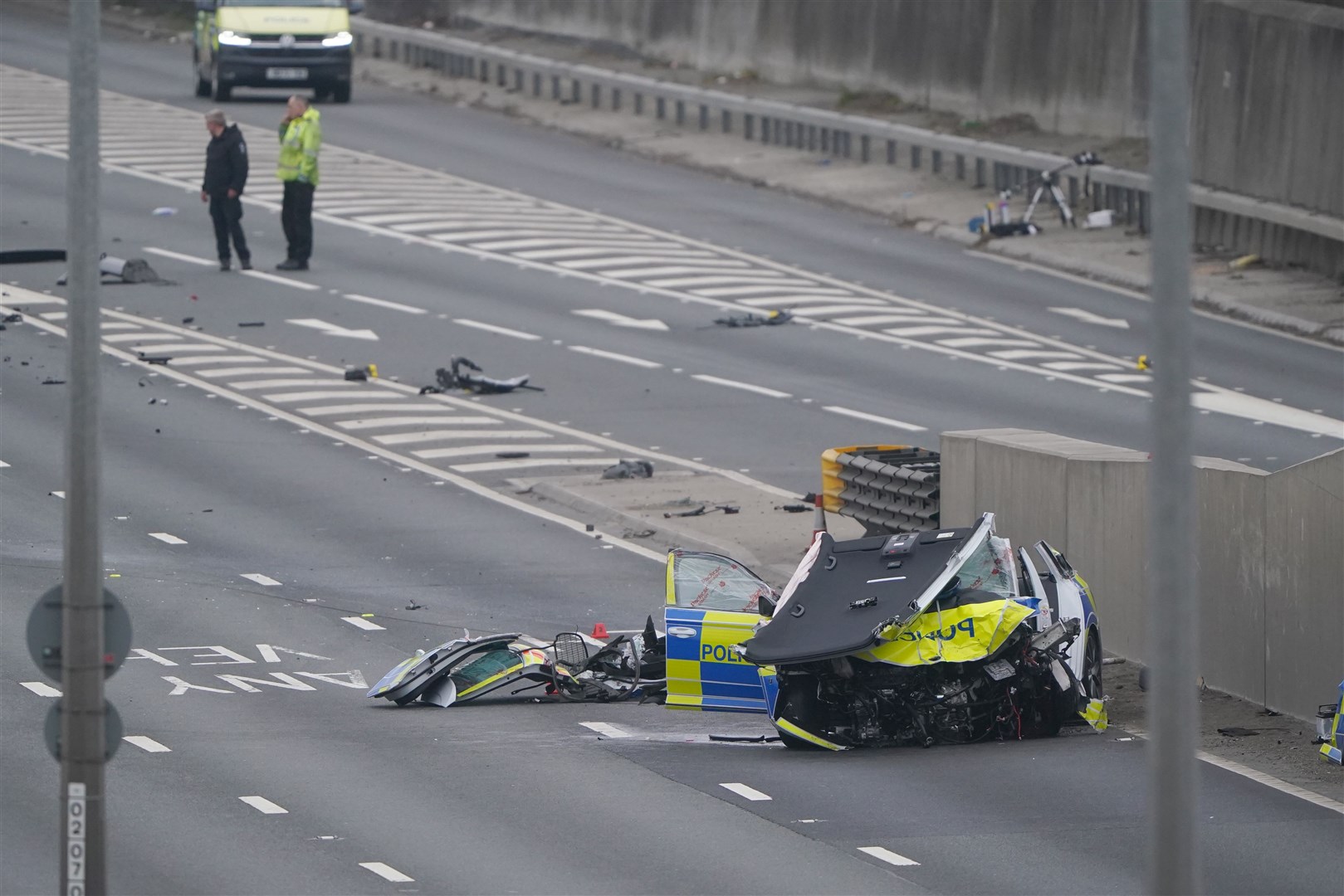One of the police vehicles had its roof torn off (Owen Humphreys/PA)