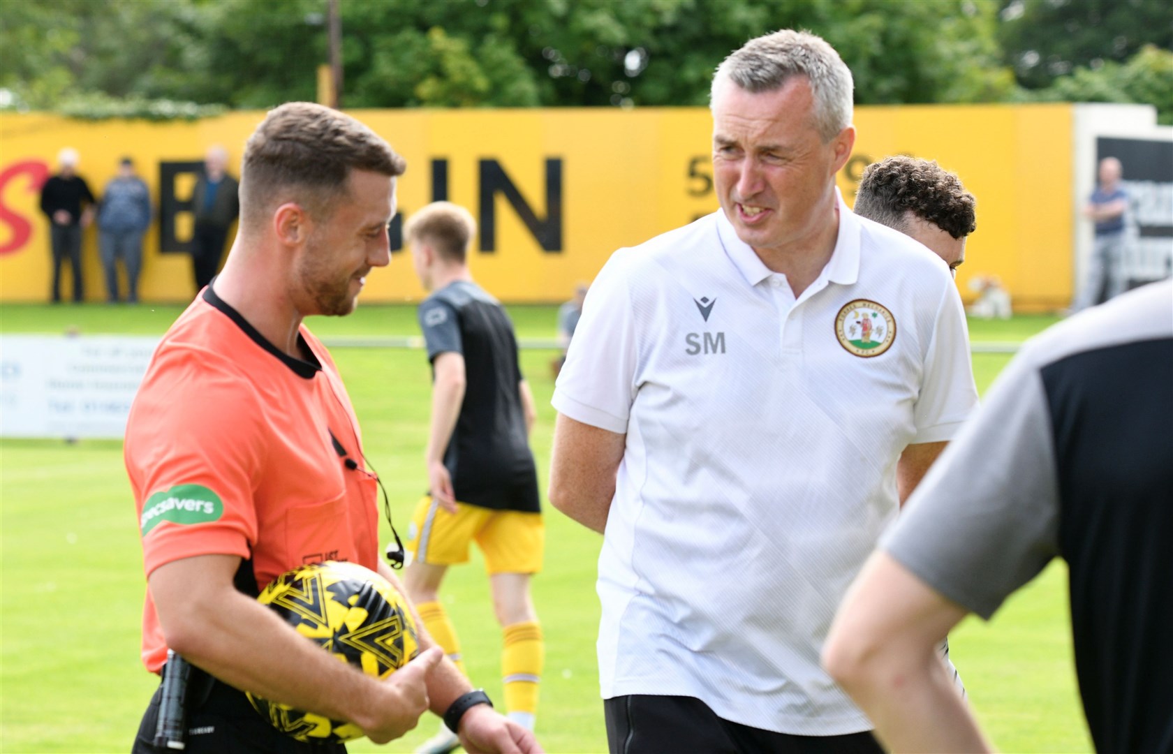 Forres Mechanics manager Steven MacDonald in discussion with referee David Alexander. Picture: Daniel Forsyth