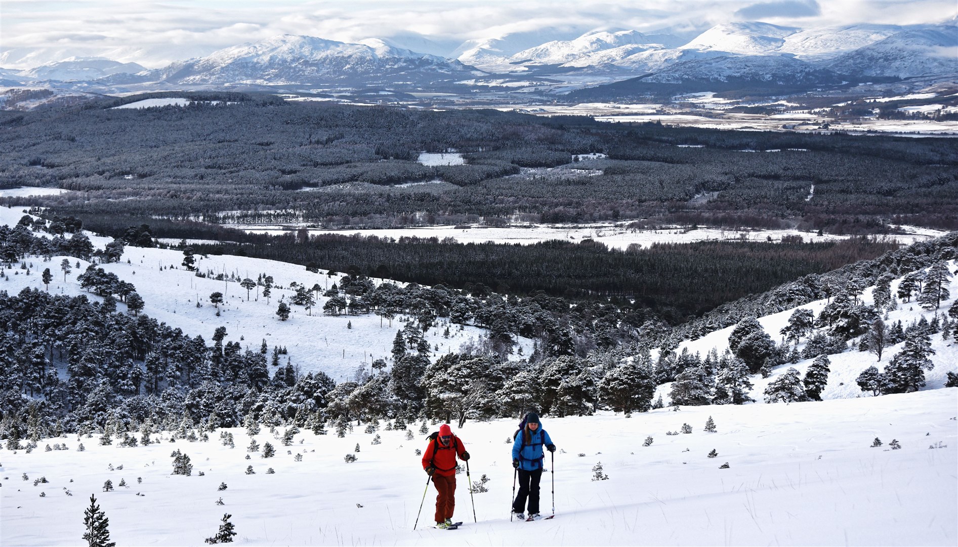 Duncan McCallum and Hannah Bailey skinning up to the summit of Sgòr Gaoith above Glenfeshie.